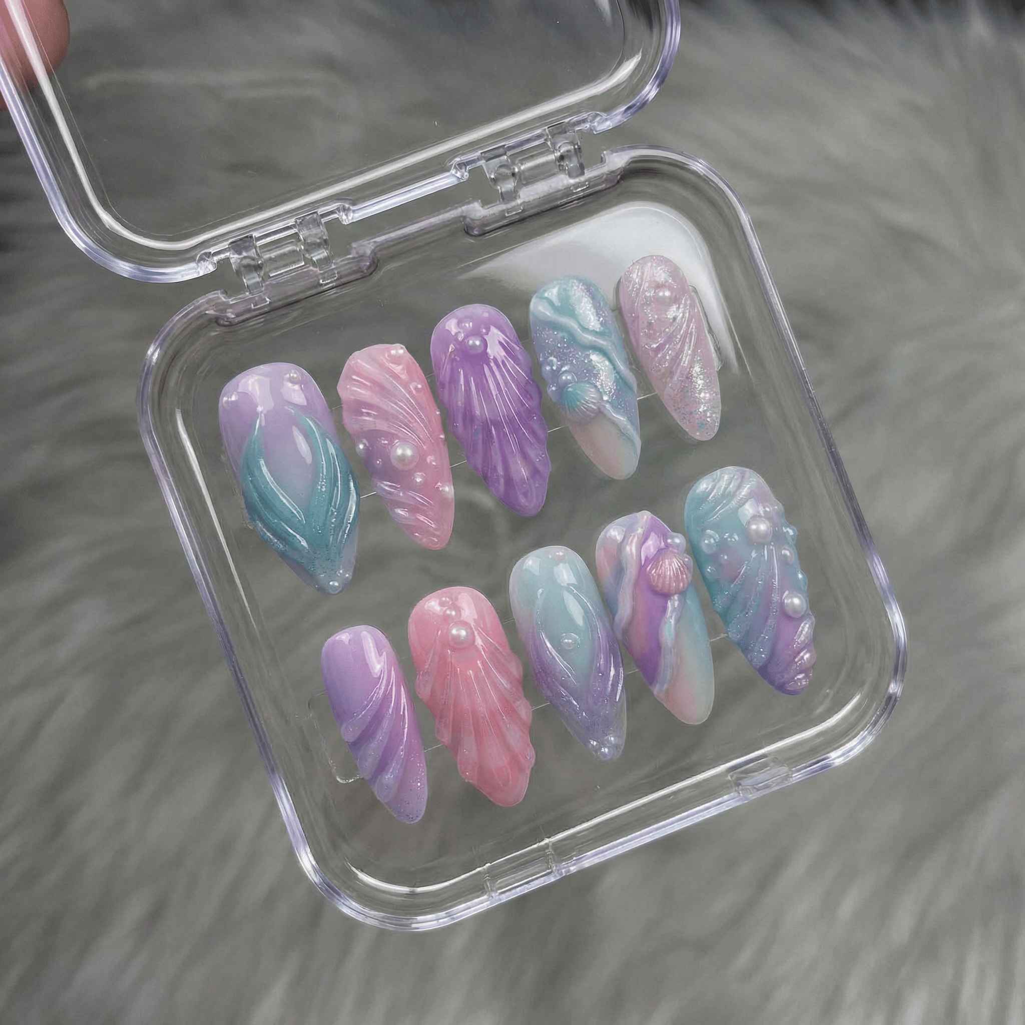 Mystic Mermaid press-on nails worn on hand – almond shape by Handora