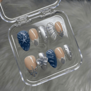 Mystic Siren press-on nails worn on hand – almond shape by Handora
