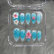 Ocean Jelly press-on nails worn on hand – almond shape by Handora