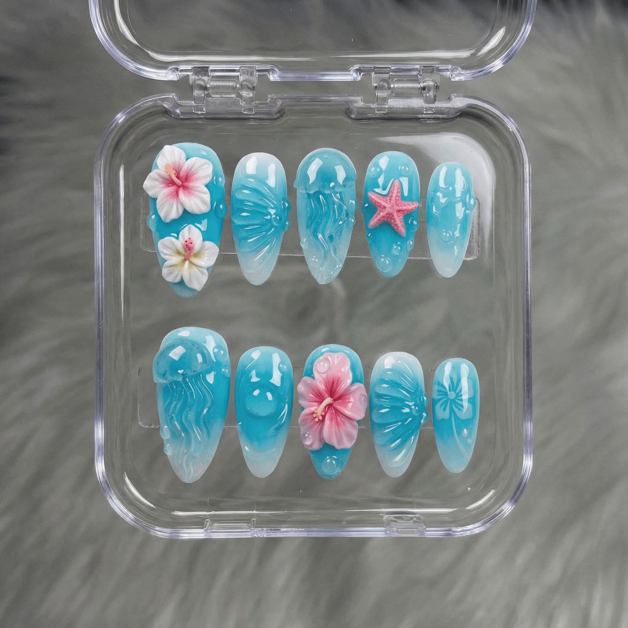 Ocean Jelly press-on nails worn on hand – almond shape by Handora