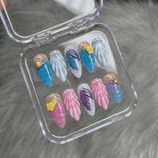 Ocean Paradise press-on nails worn on hand – almond shape by Handora