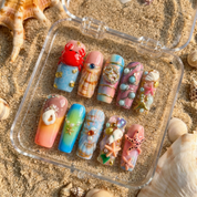 Ocean Reef press-on nails – hand-painted reusable gel set by Handora