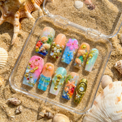Ocean Shells press-on nails worn on hand – coffin shape by Handora
