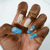 Ocean Treasures press-on nails worn on hand – almond shape by Handora