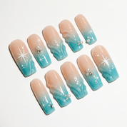 Oceanic Aura press-on nails worn on hand – almond shape by Handora