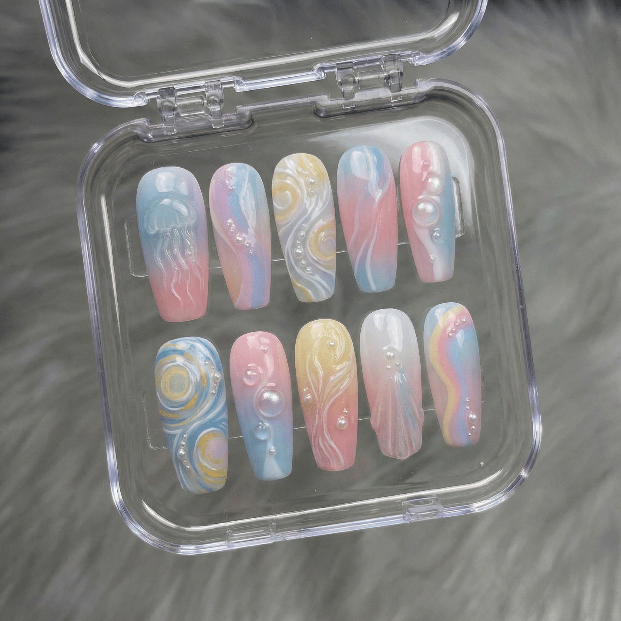 Oceanic Dreams press-on nails worn on hand – coffin shape by Handora