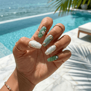 Oceanic Muse press-on nails worn on hand – almond shape by Handora