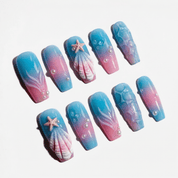 Oceanic Shimmer press-on nails worn on hand – coffin shape by Handora