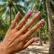 Orchid Bloom press-on nails worn on hand – coffin shape by Handora