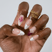 Orchid Elegance press-on nails worn on hand – almond shape by Handora