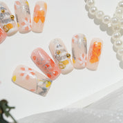 Peach Frost press-on nails worn on hand – square shape by Handora