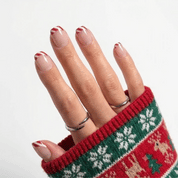 Peppermint Twist Christmas press-on nails - moving hand by Handora Nails