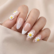 Petal Flutter press-on nails worn on hand – almond shape by Handora