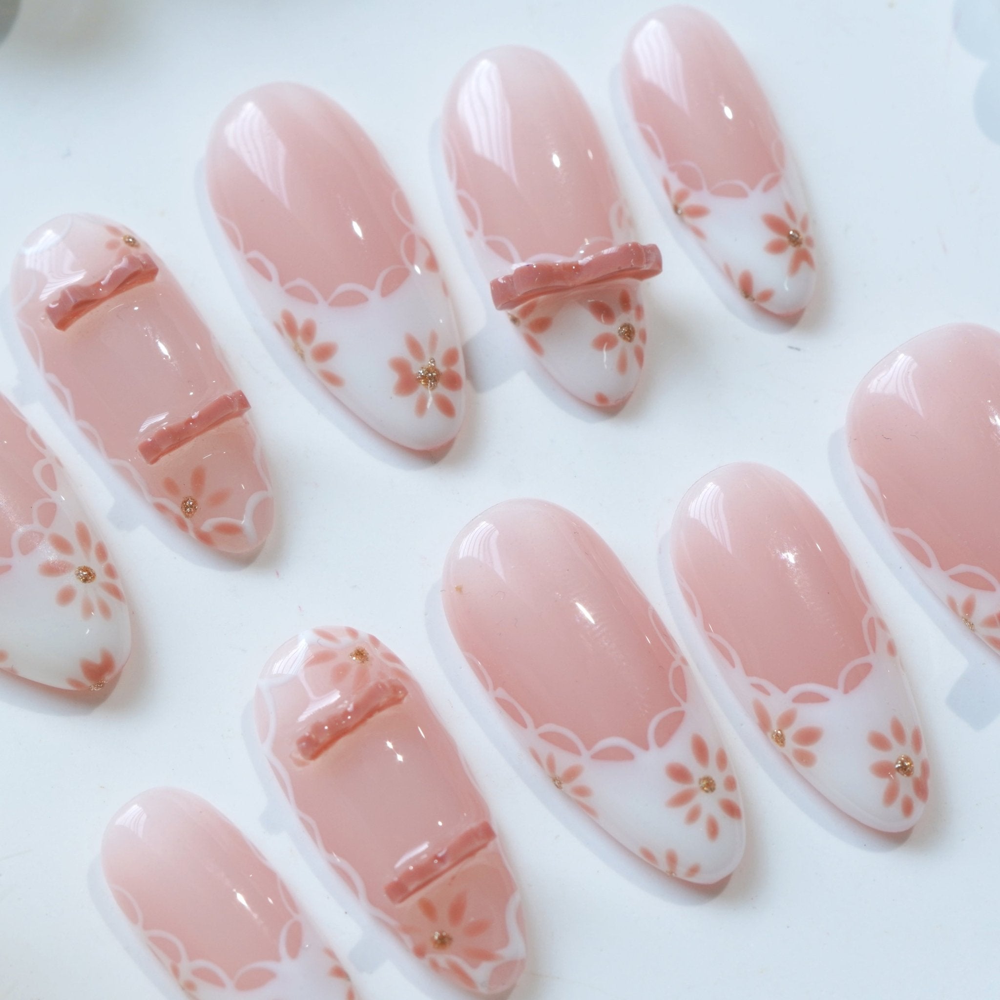 Petal Ribbon press-on nails – hand-painted reusable gel set by Handora