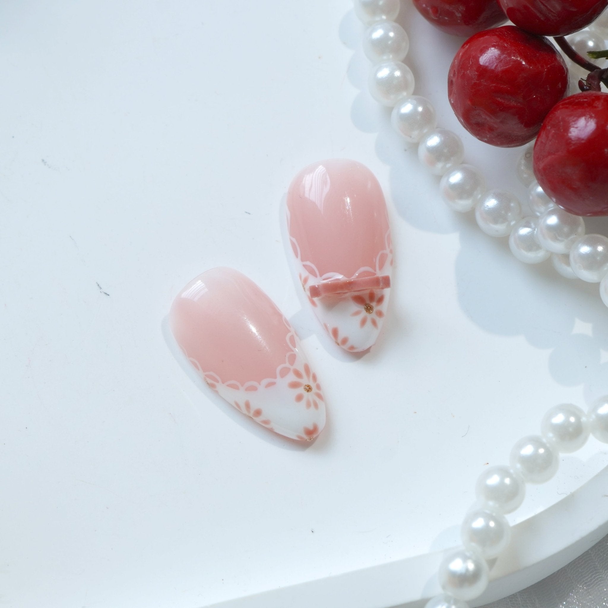 Petal Ribbon almond press-on nails – design close-up by Handora