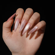 Petalmist press-on nails worn on hand – almond shape by Handora