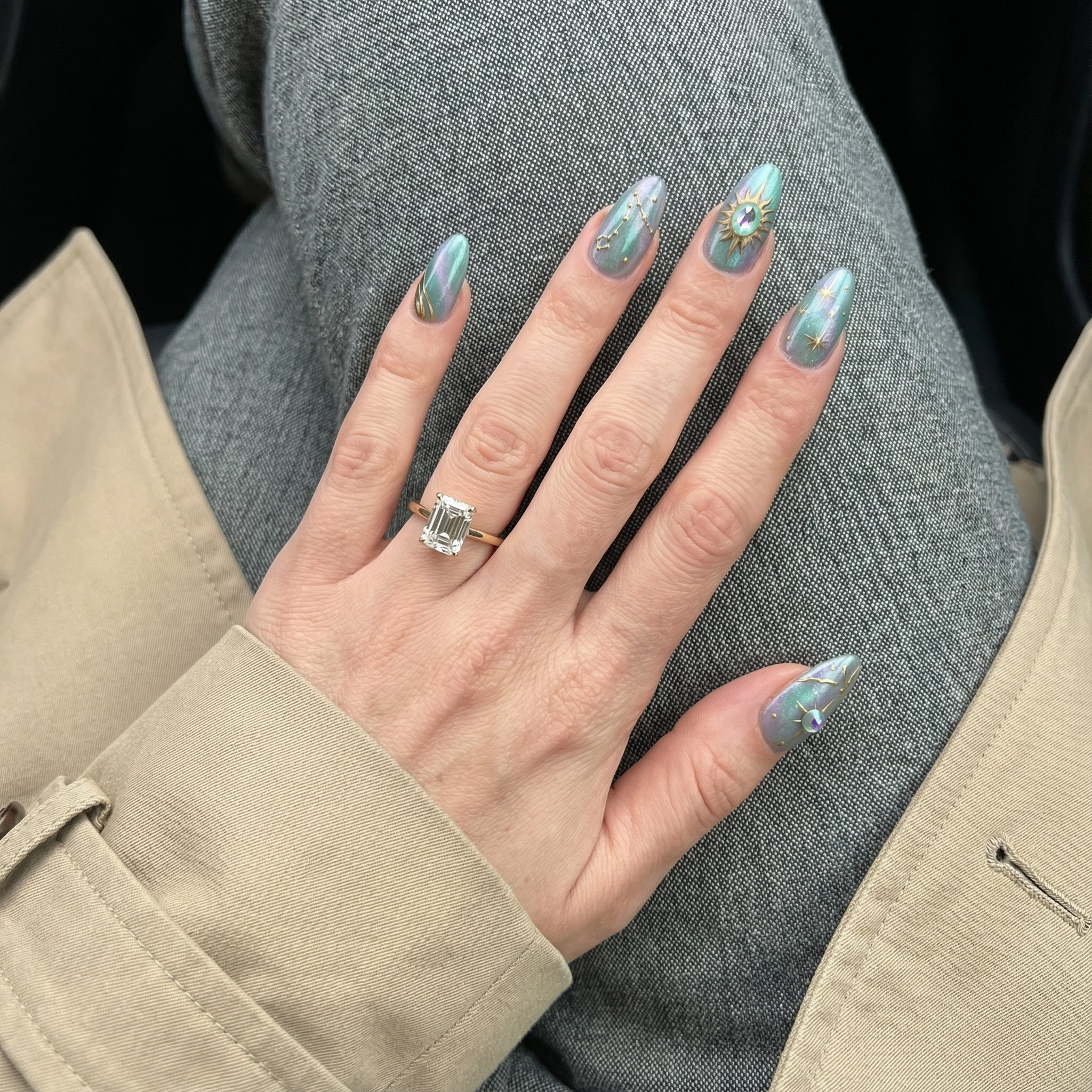 Pisces Aura press-on nails worn on hand – almond shape by Handora