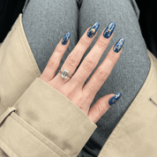 Pisces Galaxy press-on nails worn on hand – almond shape by Handora