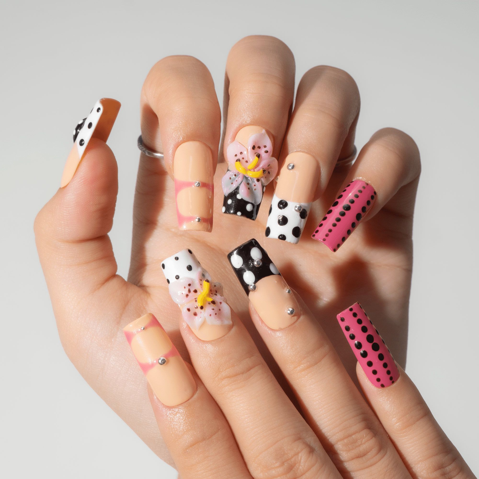 Polka Bloom Chic press-on nails – hand-painted reusable gel set by Handora