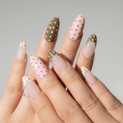 Polka Pop press-on nails worn on hand – almond shape by Handora