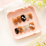Poodle Puppy press-on nails worn on hand – almond shape by Handora