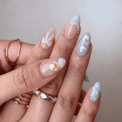 Puddle Duck press-on nails worn on hand – almond shape by Handora