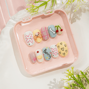 Puppy Bunny press-on nails worn on hand – almond shape by Handora