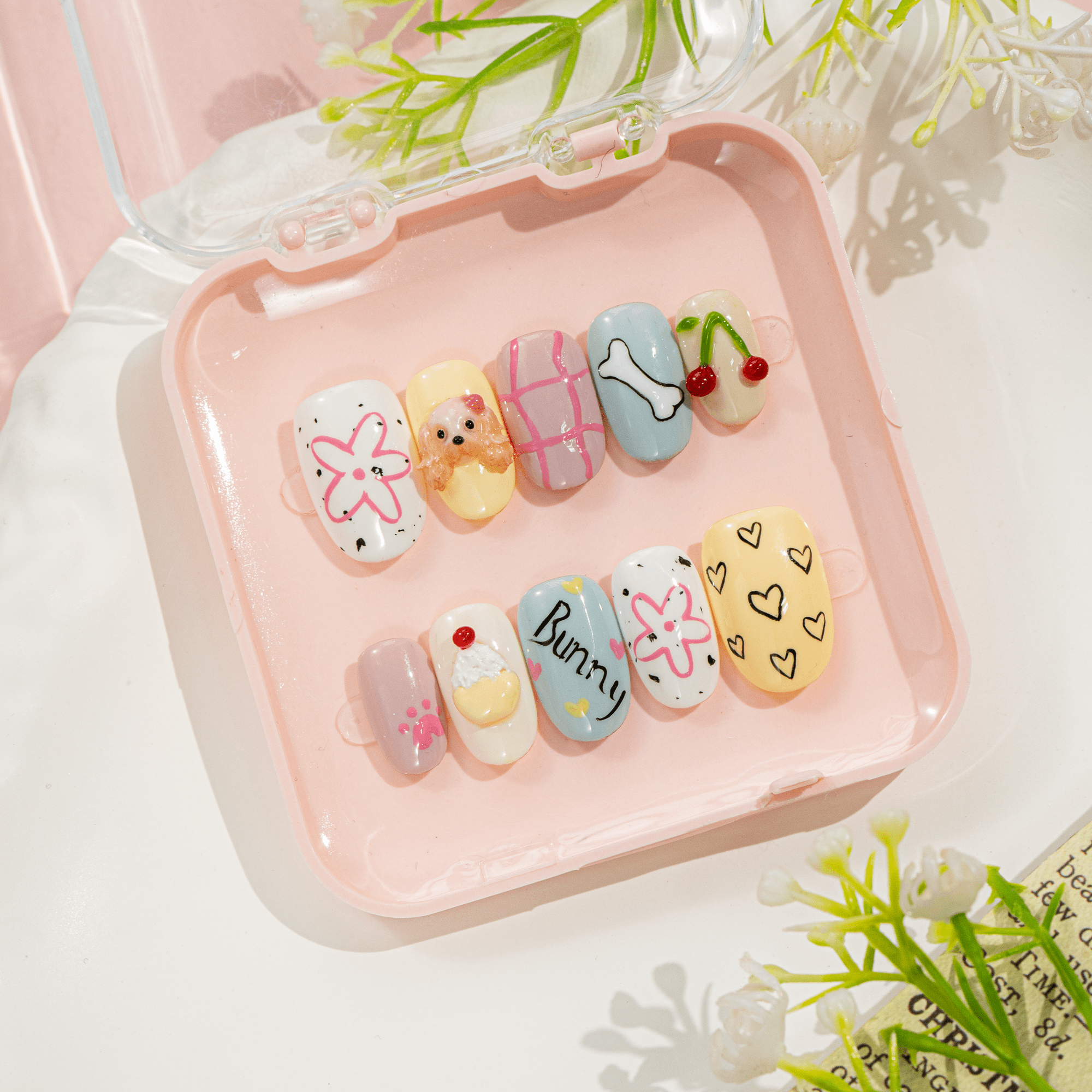 Puppy Bunny press-on nails worn on hand – almond shape by Handora