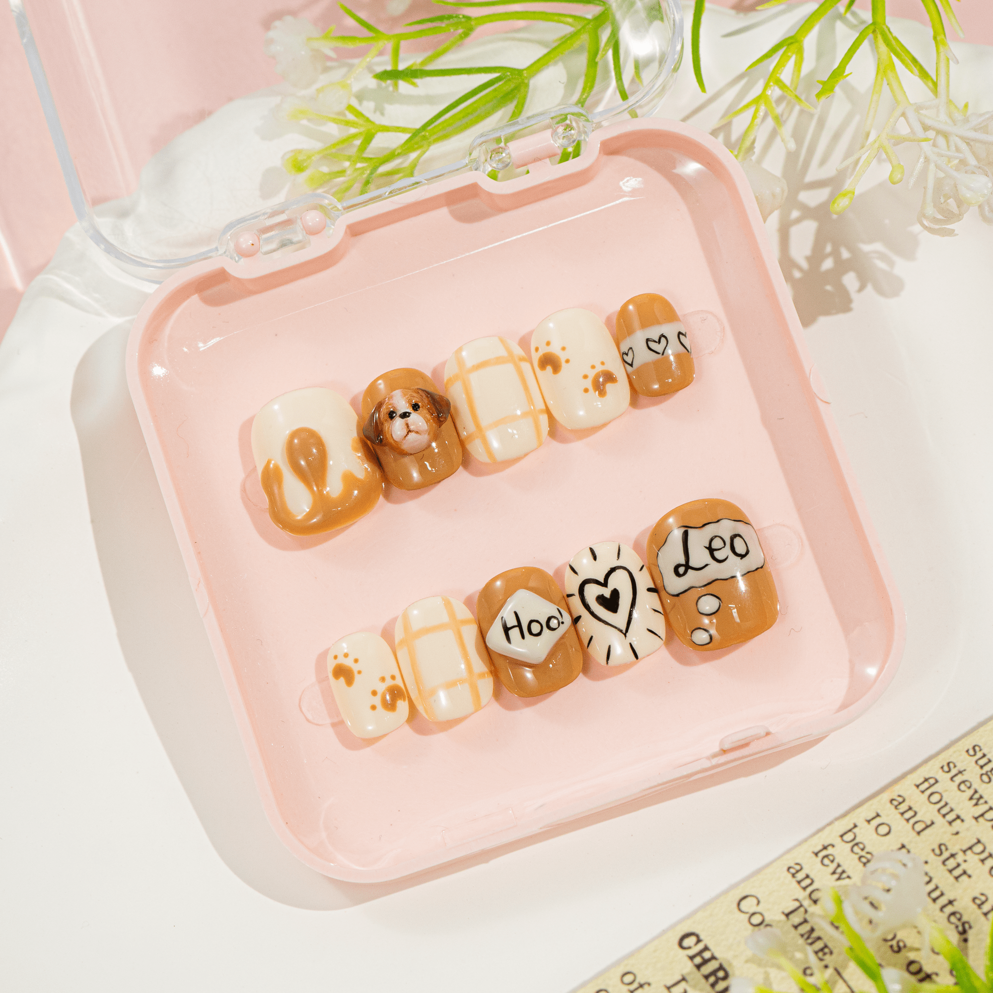 Puppy Leo press-on nails worn on hand – almond shape by Handora
