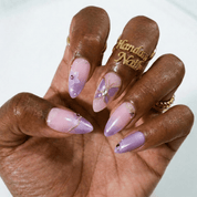 Purple Butterfly press-on nails worn on hand – almond shape by Handora