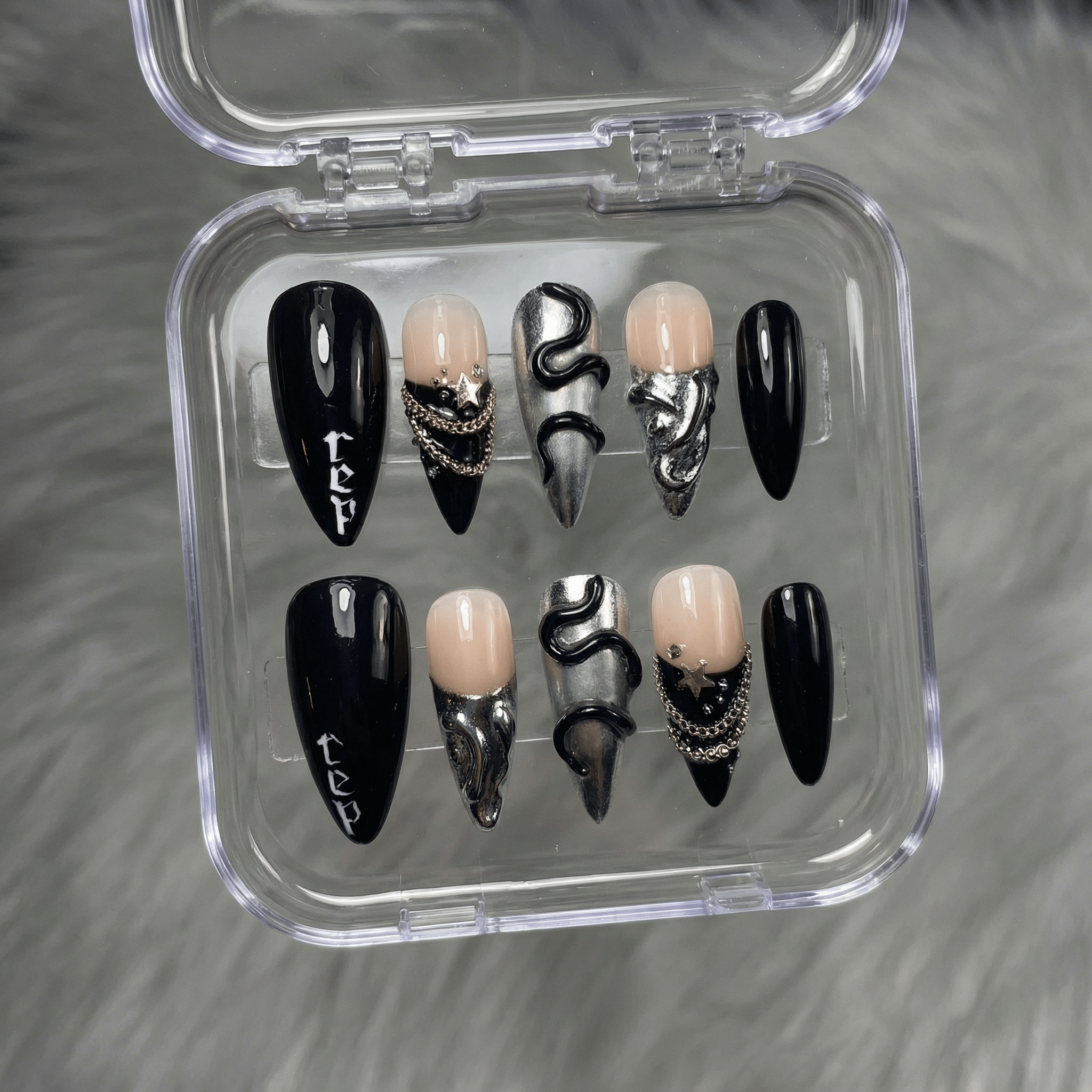 Reputation press-on nails worn on hand – almond shape by Handora