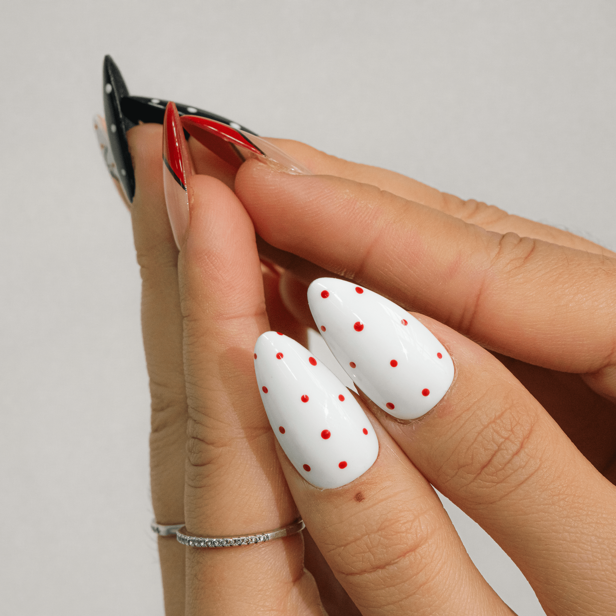 Retro Romance press-on nails worn on hand – almond shape by Handora