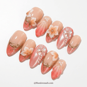 Rose Serenity press-on nails worn on hand – almond shape by Handora