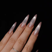 Roséglow press-on nails worn on hand – almond shape by Handora