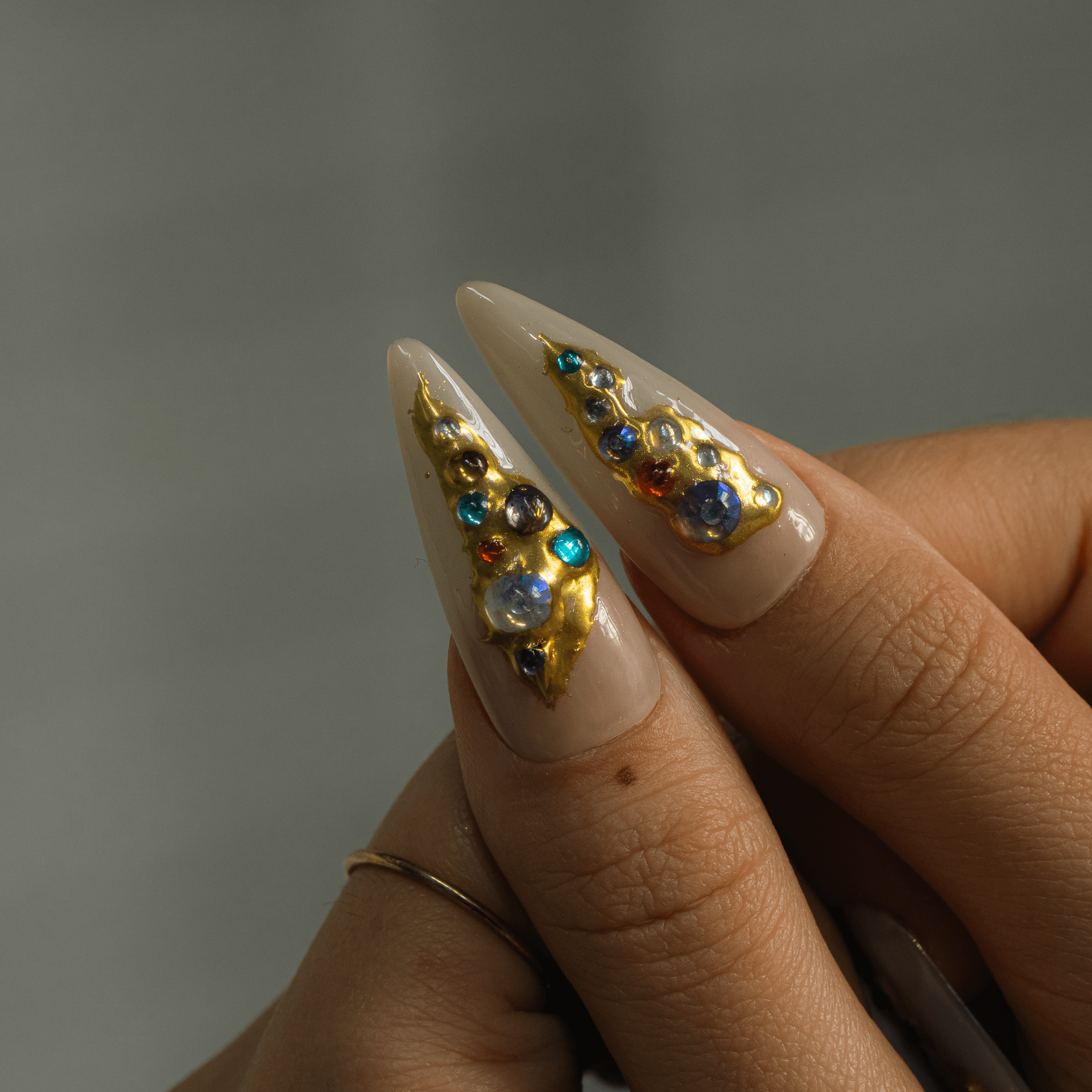 Royal Mosaic press-on nails worn on hand – almond shape by Handora