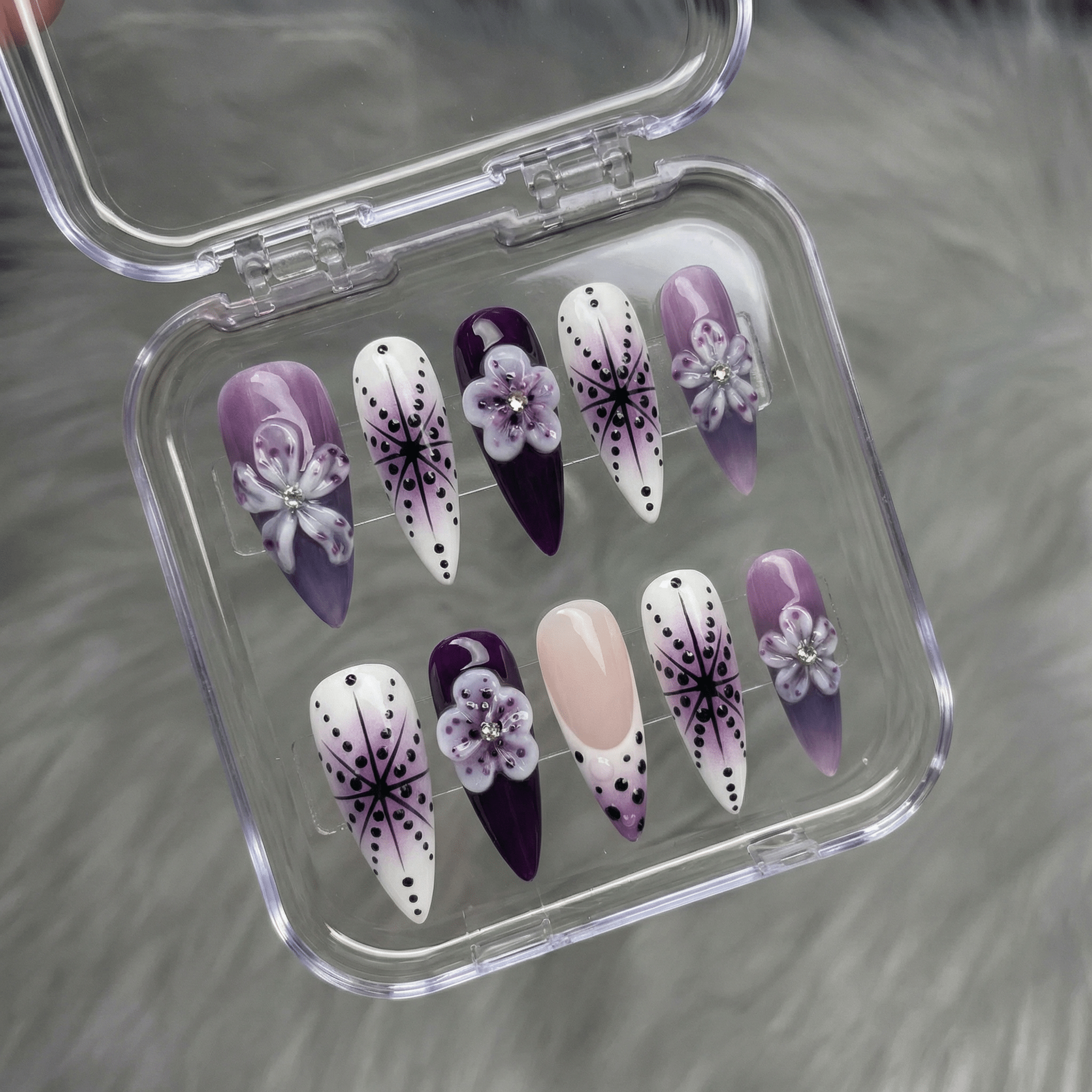 Royal Petal press-on nails worn on hand – almond shape by Handora