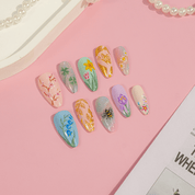 Rustic Spring press-on nails worn on hand – almond shape by Handora