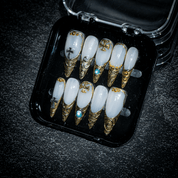Sacred Relic press-on nails worn on hand – almond shape by Handora