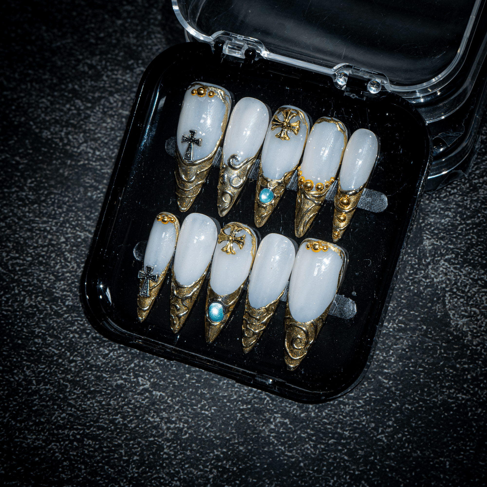 Sacred Relic press-on nails worn on hand – almond shape by Handora