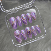 Sagi Wander press-on nails worn on hand – almond shape by Handora