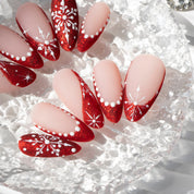 Scarlet Snow press-on nails worn on hand – almond shape by Handora