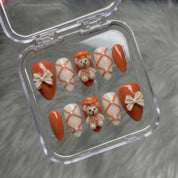Scholar Bear press-on nails worn on hand – almond shape by Handora