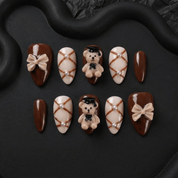Scholar Bear press-on nails worn on hand – almond shape by Handora