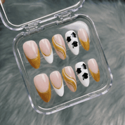 Scholar Spirit press-on nails worn on hand – almond shape by Handora