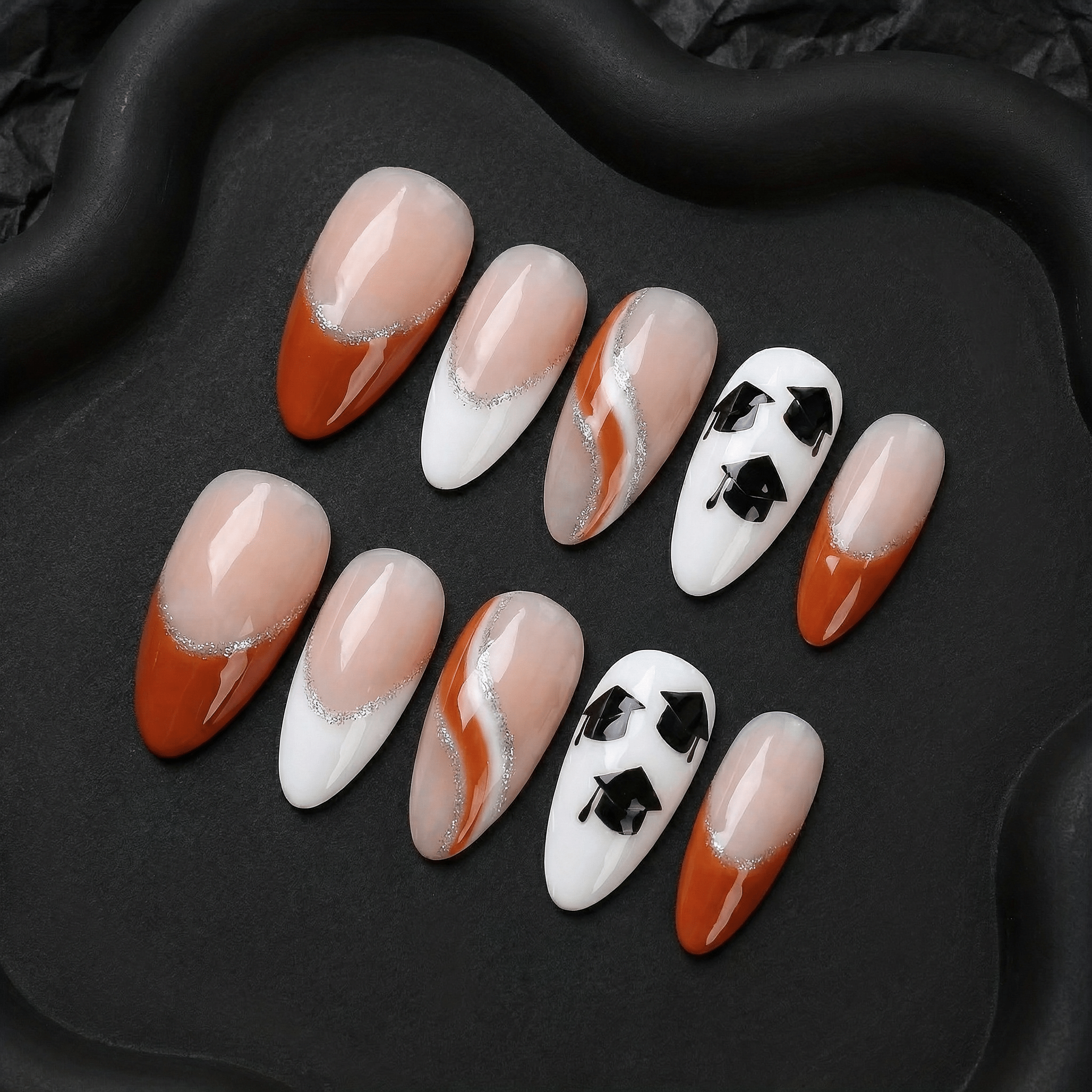 Scholar Spirit press-on nails worn on hand – almond shape by Handora