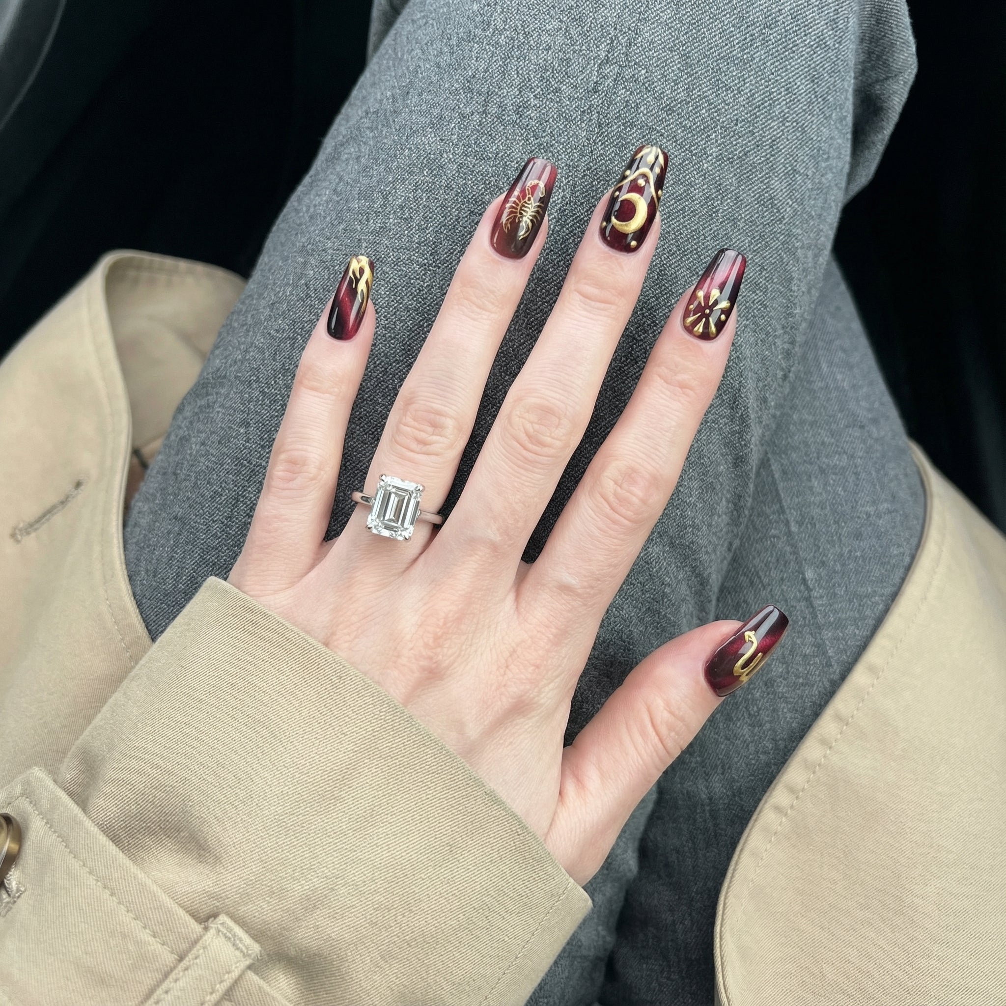 Scorpio Mystique press-on nails worn on hand – almond shape by Handora
