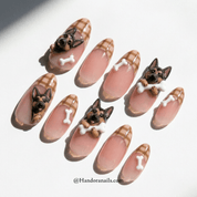 Shepherd Plaid press-on nails worn on hand – almond shape by Handora