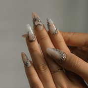 Silver Aura almond press-on nails – design close-up by Handora