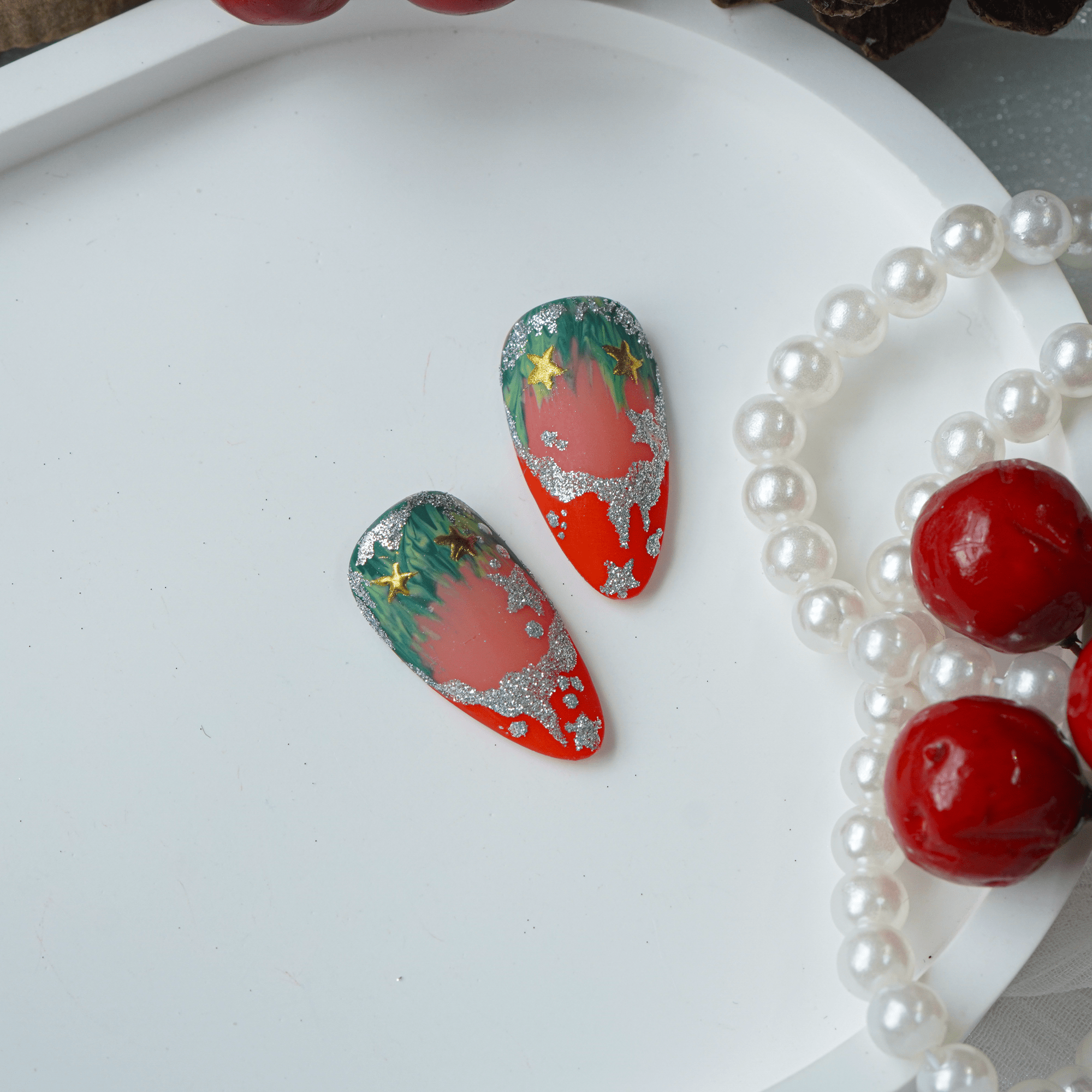 Silver Bloom press-on nails worn on hand – stiletto shape by Handora