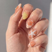 Siren Glaze press-on nails worn on hand – almond shape by Handora